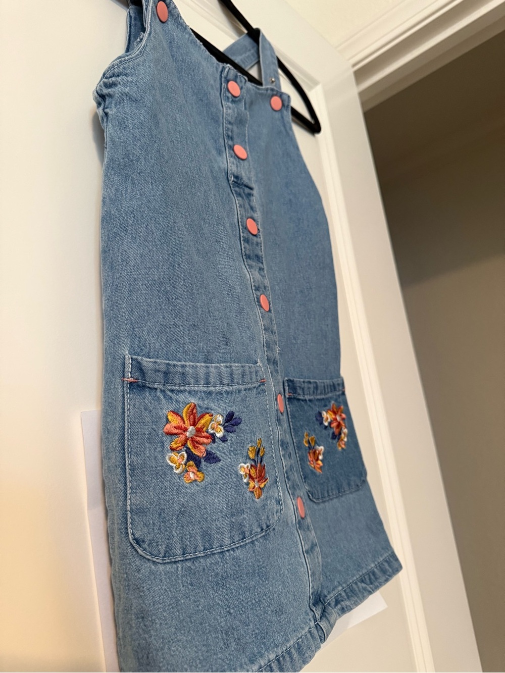 Girls Denim Pinafore Dress with Pink Buttons and Floral Embroidered Pockets - Picture 4 of 7